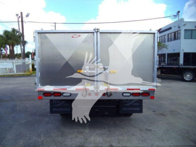 Isuzu NPR-HD dump truck rear view showing dual rear doors, reflective tape, and bumper lights.