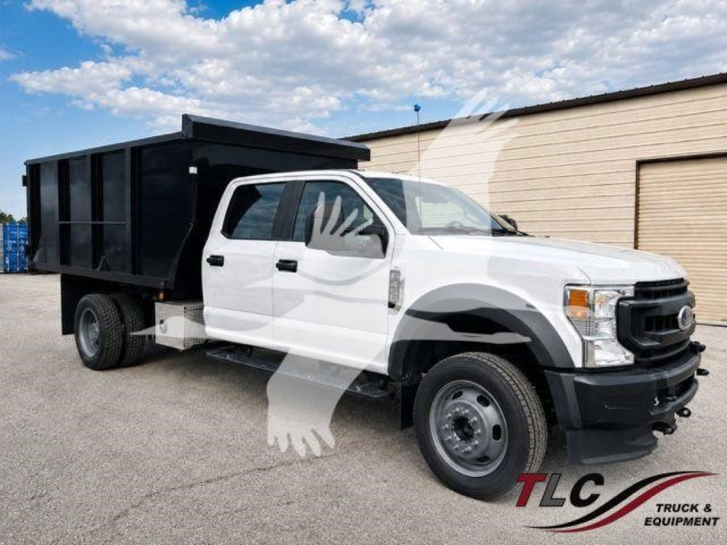 Ford F-450 XL dump truck side view showing white cab and black dump body with TLC logo watermark.