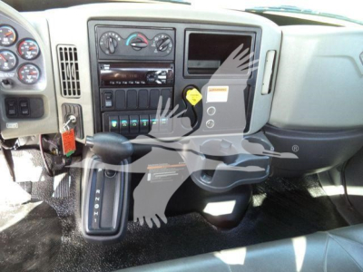 Dashboard of a 2019 International Durastar 4300 rollback truck showing center console and gear selector.