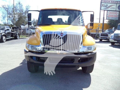 2019 International Durastar 4300 rollback truck front view with yellow cab and chrome grille.