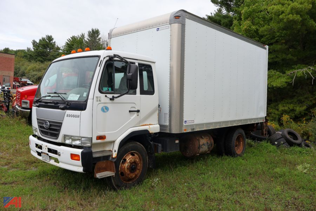 Truck with box body showing Nissan UD2300 chassis and cargo box.