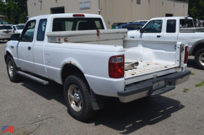 Ford Ranger pickup truck 2005 4x4 rear bed view showing open tailgate and metal toolbox in bed