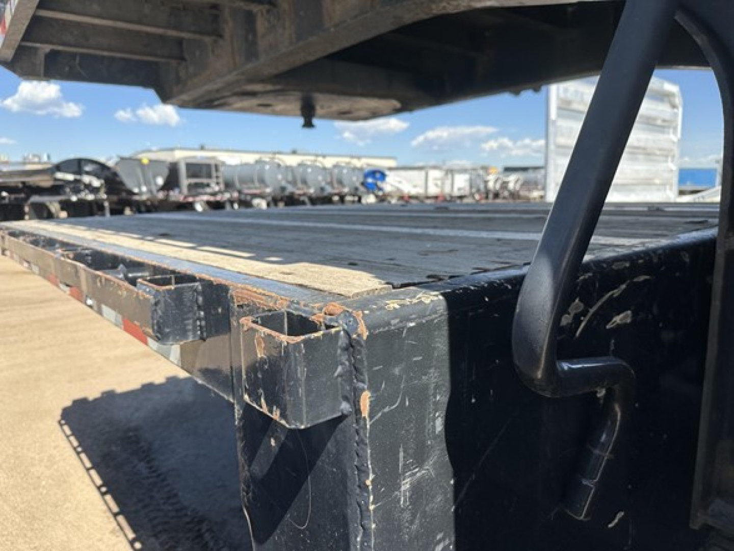 Drop deck of a used 2017 Great Dane steel air drop trailer showing edge of deck and support beam.