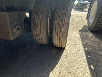 Great Dane steel spread air drop deck trailer wheel area showing dual rear tires and frame components.