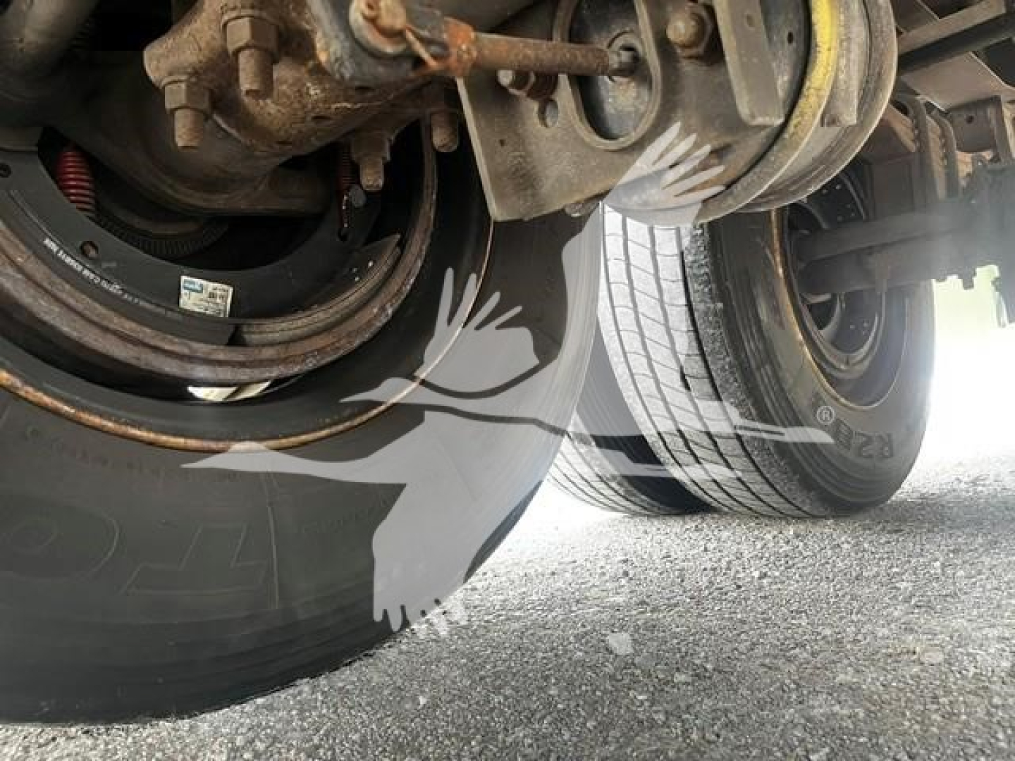 Trailer wheel assembly showing dual tires and undercarriage components of a used 2017 Wabash trailer, with visible brake drum, suspension, and tire treads.