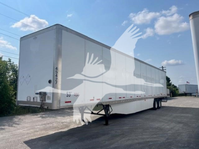 Trailer side with white Wabash trailer, rear and side markings visible. text includes 45427? and 53? on nose, no other legible labels.