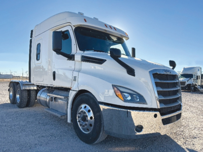 Truck front-right angle view showing 2020 Freightliner Cascadia126 sleeper cab with white exterior and large grille.