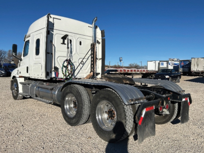 Freightliner Cascadia126 tractor with sleeper cab showing rear and side view, chassis and dual rear axles.