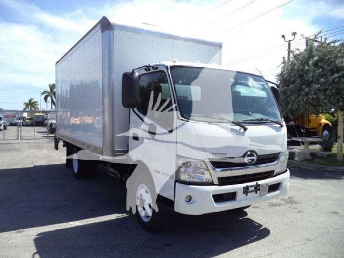 Hino 195 box truck in-service showing cab and closed cargo box with front view and side-shadowed logo.