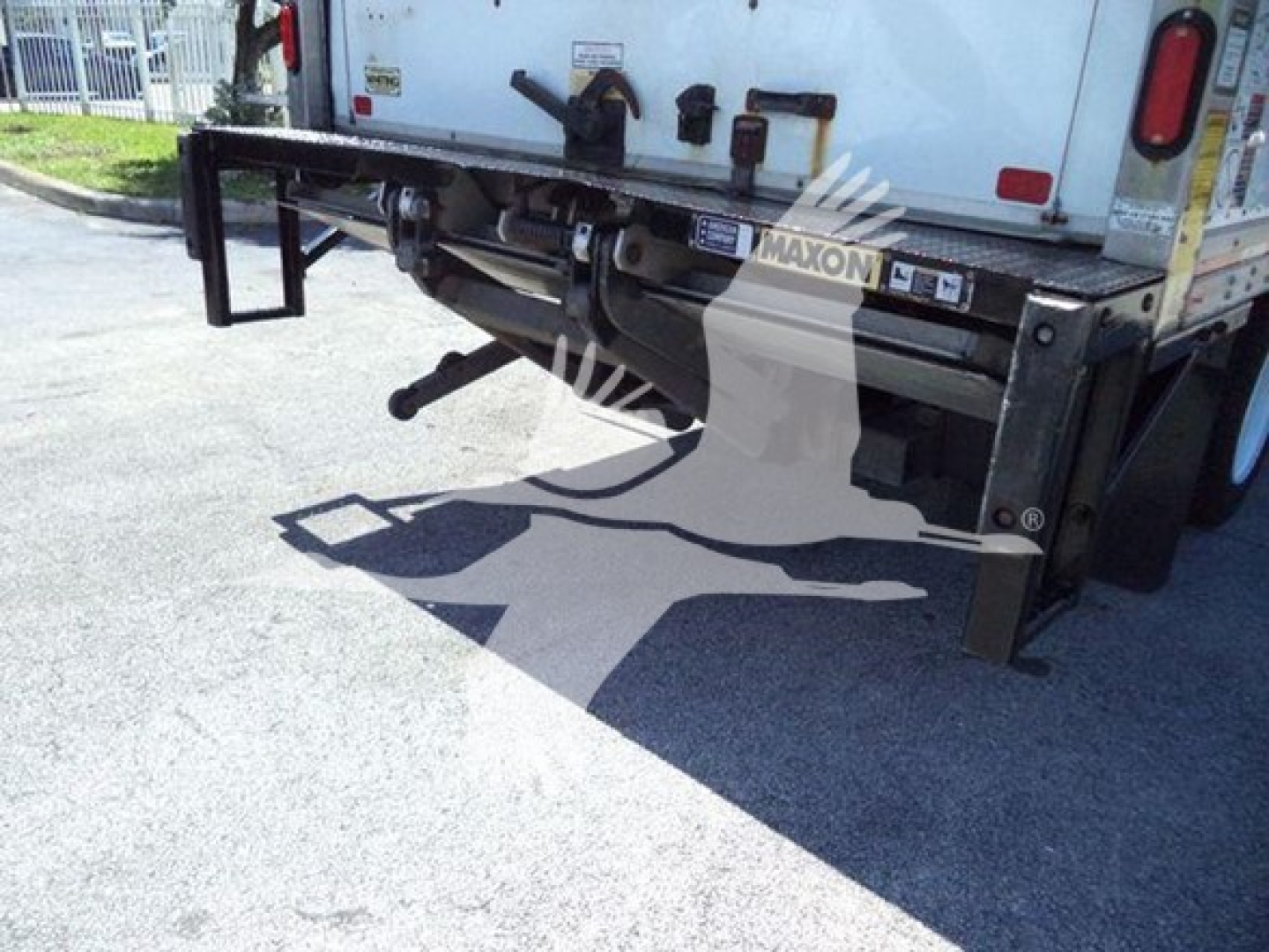 Rear view of a 2020 Hino 195 box truck showing rear bumper, hitch, and rear lighting with Maxon branding.