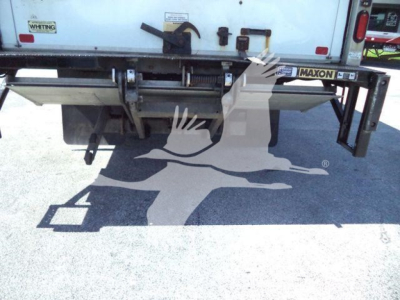 Rear view of a 2020 Hino 195 box truck showing tailgate and Maxon lift gate with visible labels.