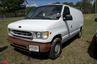 White 2001 Ford E150 cargo van front-left view showing grille headlights bumper and side door
