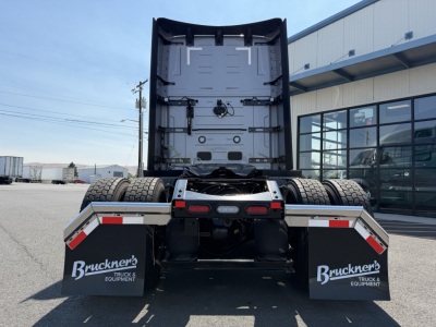 Rear view of a Volvo VNL truck tractor showing the fifth-wheel area and dual rear axles with mud flaps labeled Bruner's Truck Equipment.