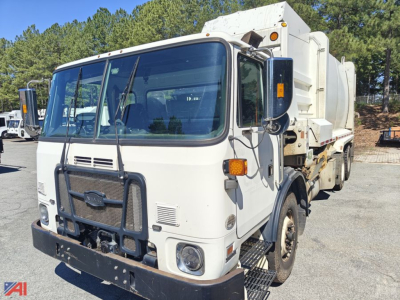 Autocar Xpeditor Packer truck in serviceable condition showing front and right side with cargo body.