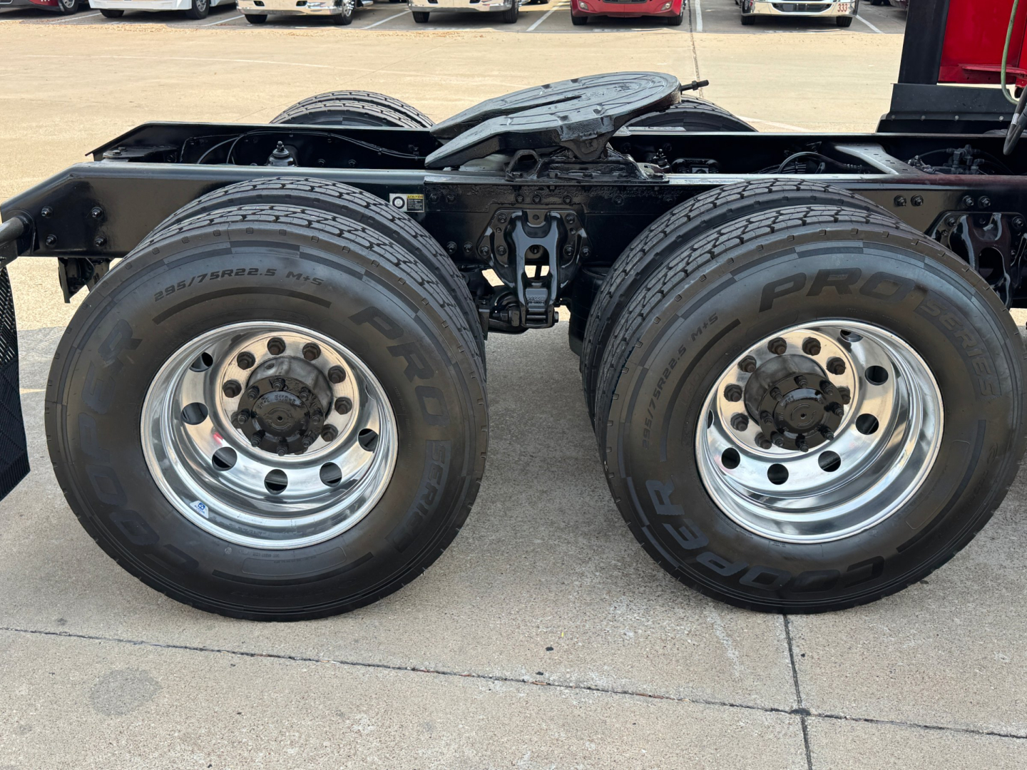 Kenworth T680 rear wheel assembly showing dual rear tires and chassis framing.