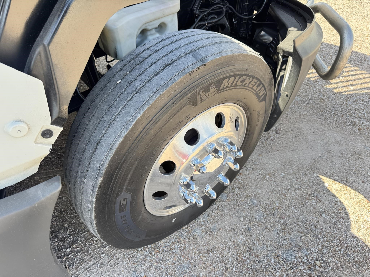 Truck wheel and tire close-up with Michelin tire on front axle of a 2020 International LT conventional sleeper.