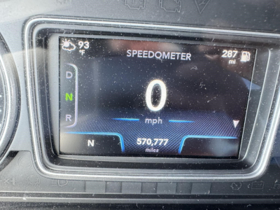 Dashboard display showing speedometer at 0 mph, gear selector in N, 570,777 miles, 287 mi trip, outside temperature 93°F, VIN B3032P listing for 2020 International LT conventional sleeper truck