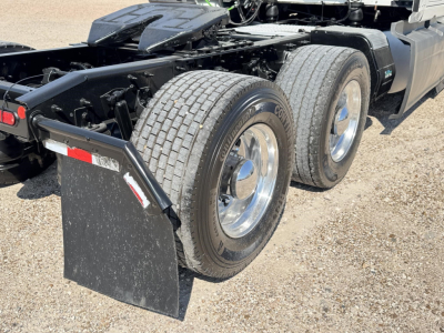 Dual rear wheel tractor unit showing dual rear tires and mudflap.