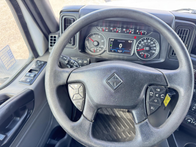 Dashboard and steering wheel of a 2020 International LT, with instrument cluster, controls on steering wheel, and center display.