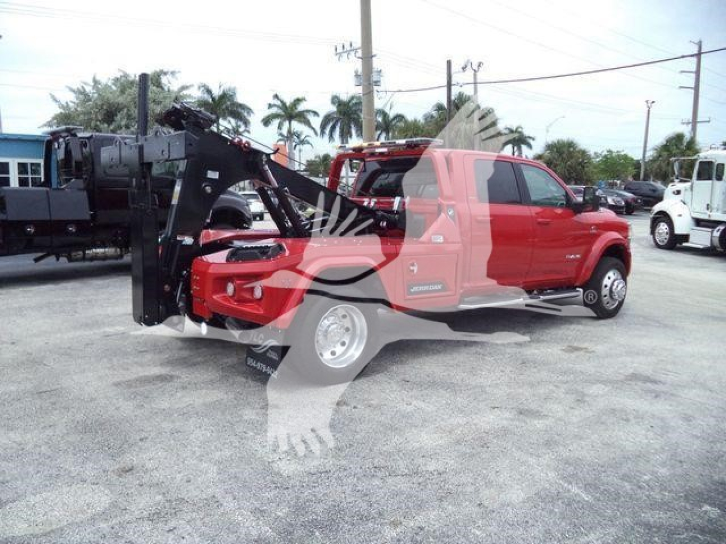 Ram 2024 Ram Laramie pickup truck with winch equipment mounted on front, side view, red color, stock number J40124FM, dealership lot.