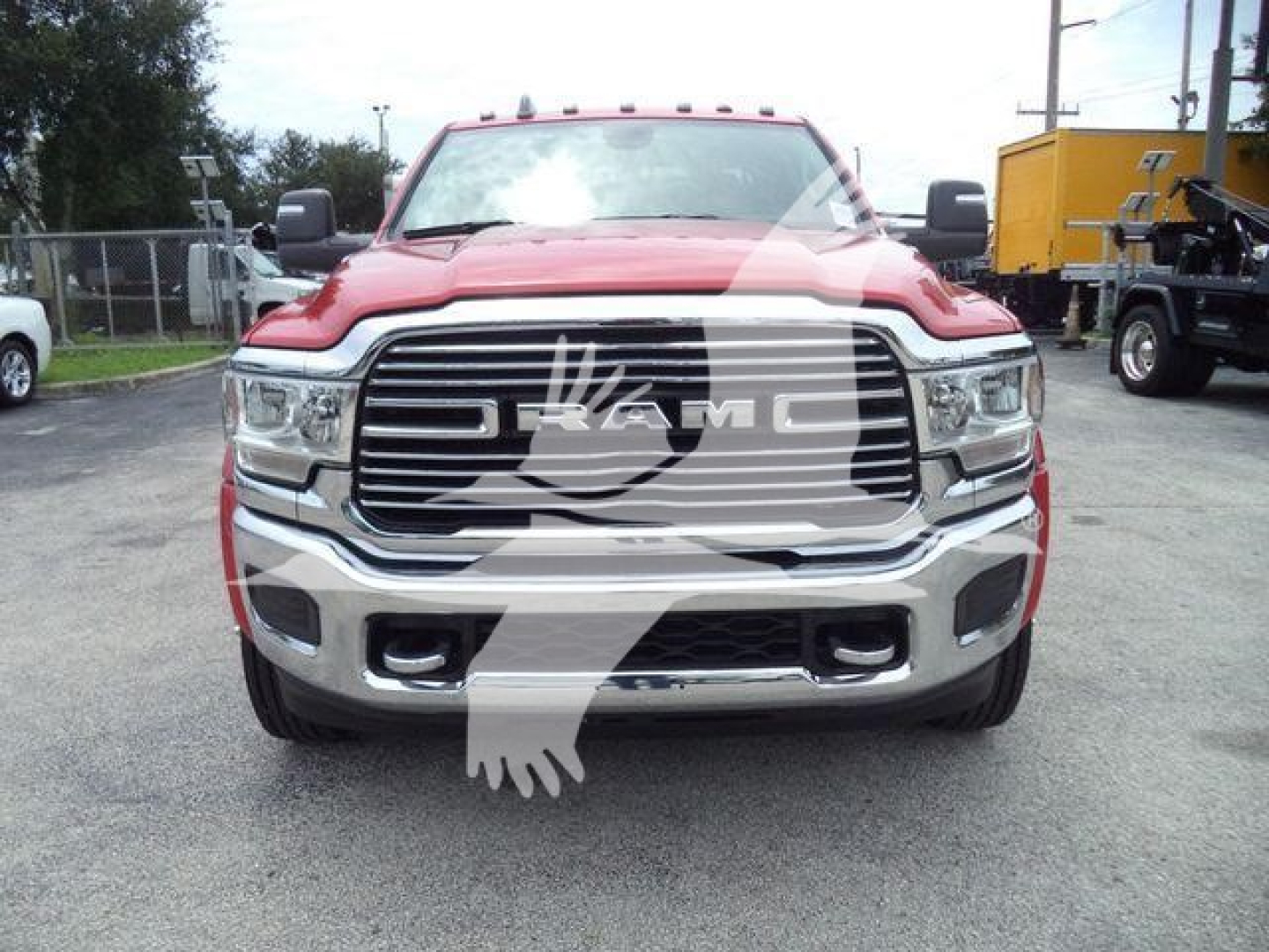 Ram truck front view showing RAM grille badge and chrome bumper.