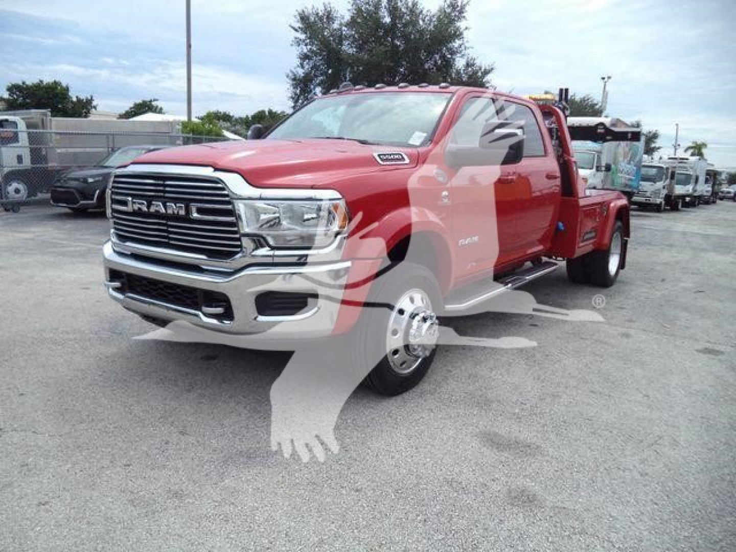 Ram truck with lift in red color showing front grille RAM lettering and chrome bumper, winch category.