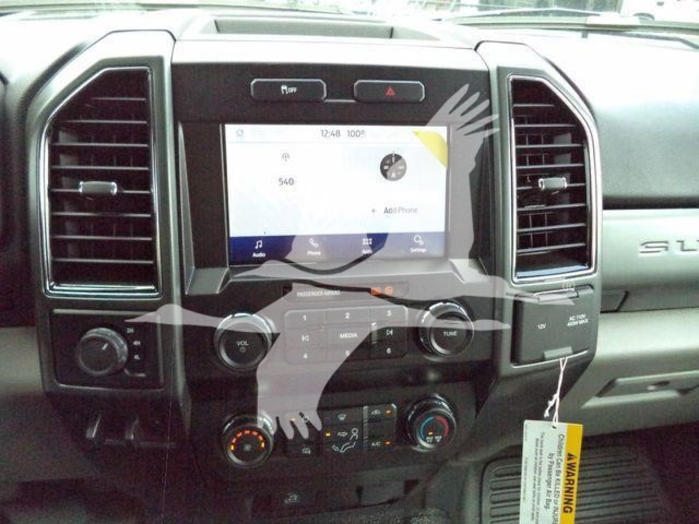 Ford F-550 dashboard with center touchscreen and climate controls.