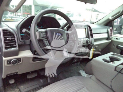 Ford F-550 interior dashboard and steering wheel view showing center console and seating.