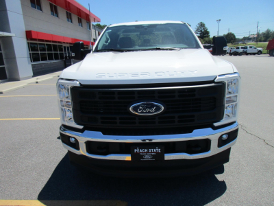 Front view of a white 2026 Ford F-250 Super Duty truck showing Ford emblem grille and Peach State dealership plate.