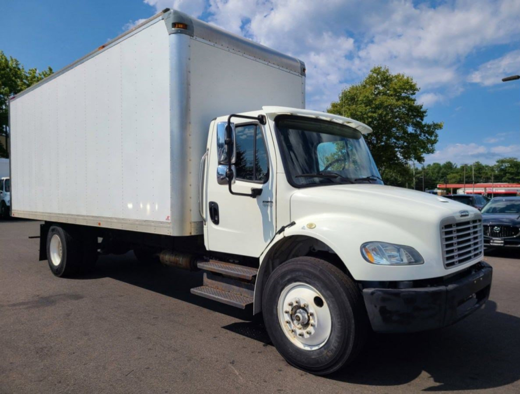 Box truck showing Freightliner M2-106 medium-duty box with cab and chassis and white cargo body.