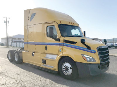 Freightliner Cascadia126 sleeper cab tractor showing exterior side and front with yellow paint and blue stripe.