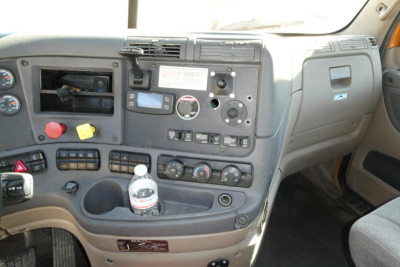 Cab interior of 2016 Freightliner Cascadia 125 daytime cab showing dashboard controls, gauges, and center console.