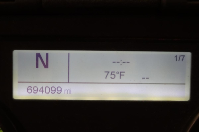 Cab Display showing N gear, 75F temperature, 694099 mi odometer on Freightliner Cascadia dash.