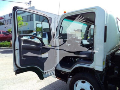 Isuzu truck cab with open driver's door showing interior seat and steering wheel; white exterior, black interior, side mirror, and front wheel visible.