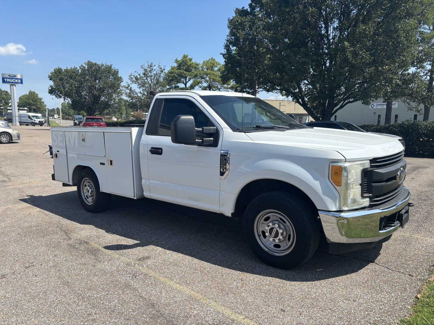 Ford F-250 utility cab and chassis truck, white, side view, with service body and dual rear wheels, VIN 1FDBF2A63HEC91514 visible on listing info.