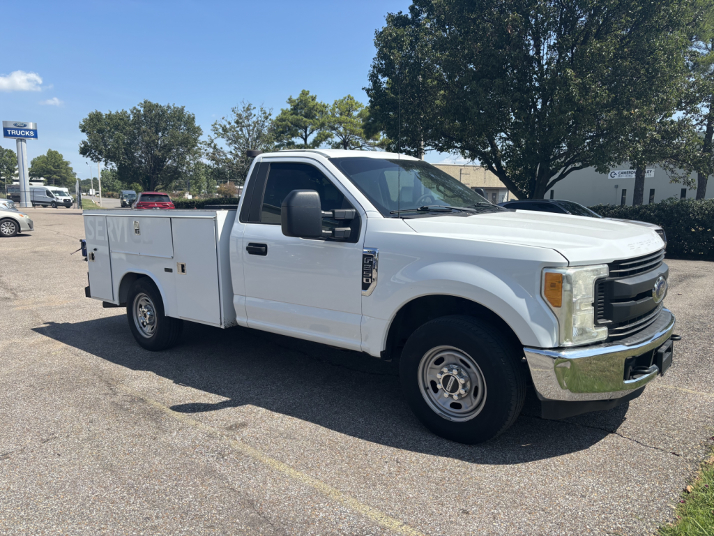 Ford F-250 utility cab and chassis truck, white, side view, with service body and dual rear wheels, VIN 1FDBF2A63HEC91514 visible on listing info.