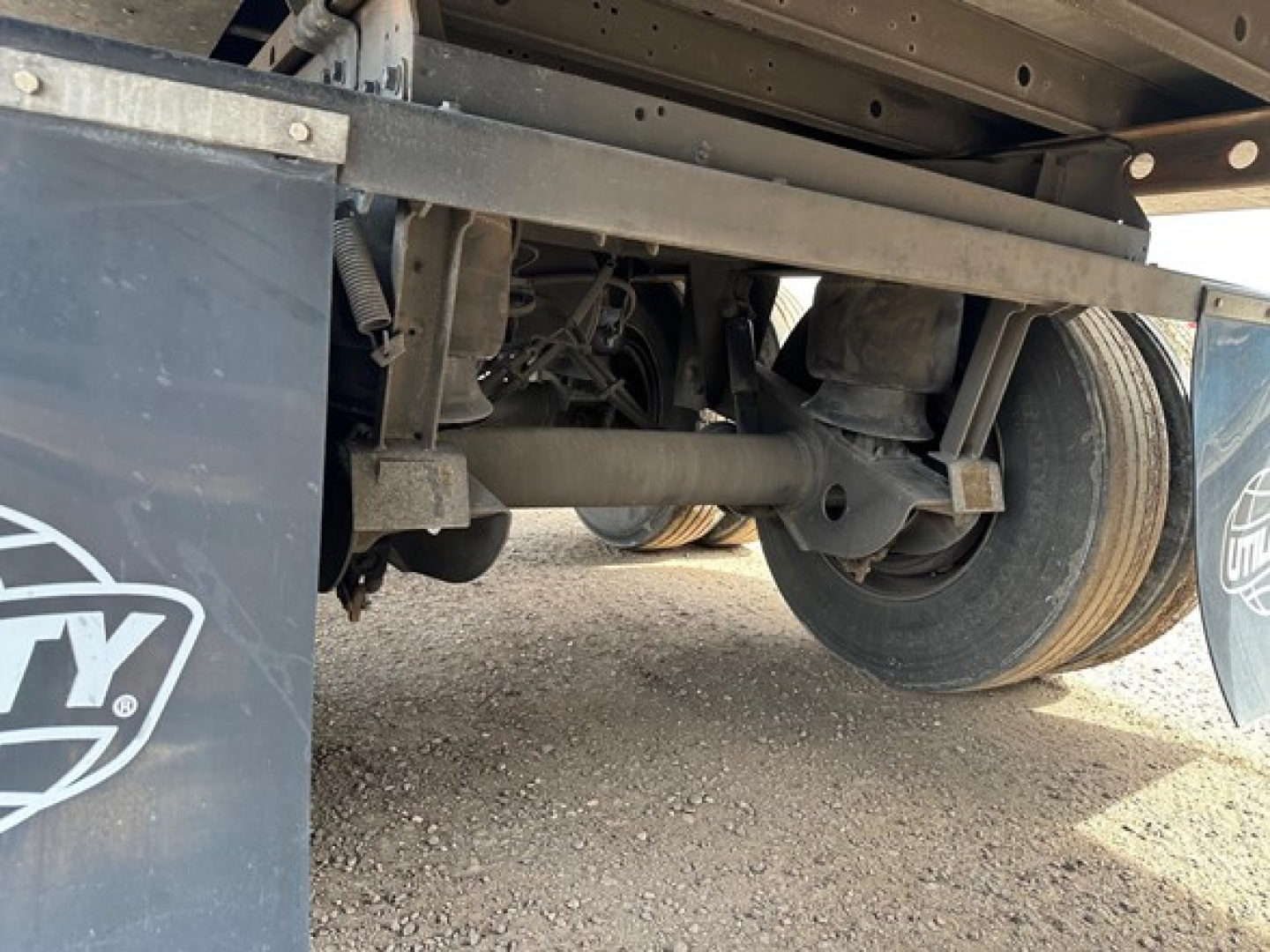 Trailer undercarriage of a 2022 Utility 3000R reefer trailer showing axle assembly, suspension, and wheels.