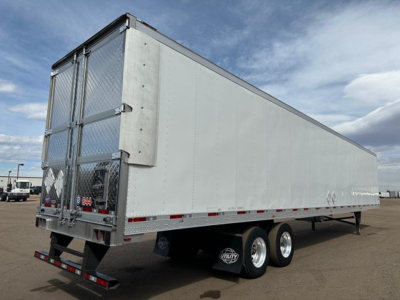 Utility 3000R trailer side view showing aluminum reefer trailer with dual rear doors and tandem axles.