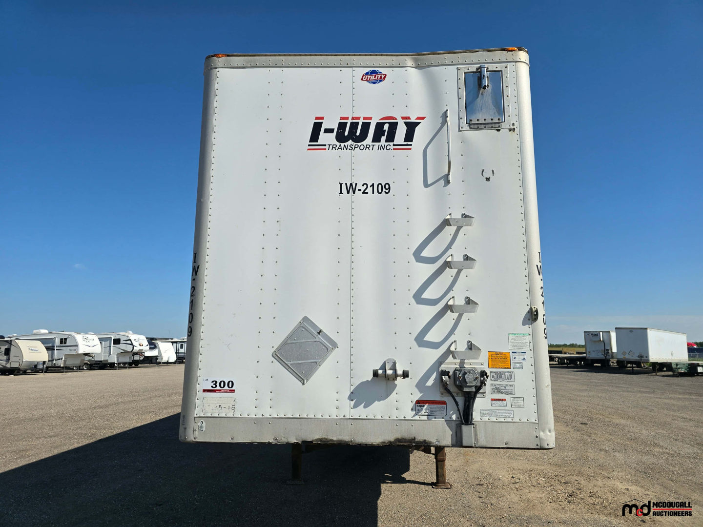 Utility 4000D-X 53' tandem dry van trailer rear view showing undercarriage and lashing/ladder, with i-WAY Transport logo and model details.