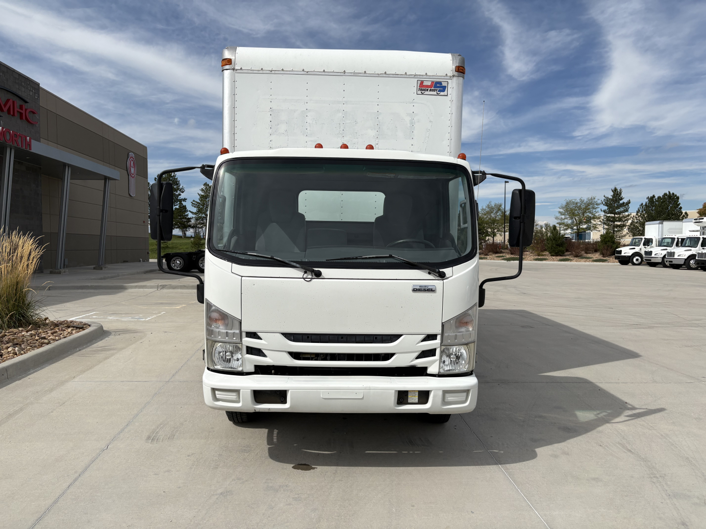 Isuzu NPR-HD box truck front view showing cab and cargo box with VIN JALC4W161K7007622 visible
