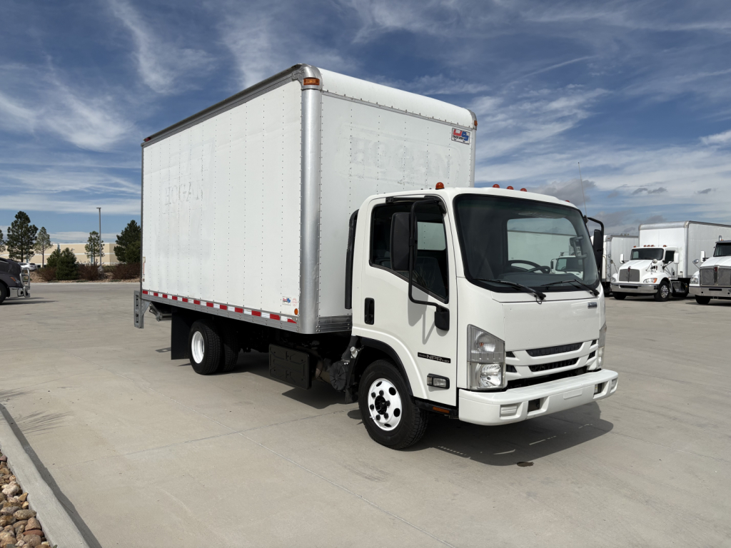 Isuzu NPR-HD box truck with white cab and cargo box; side of cab shows no visible text; no legible labels or fluid reservoirs visible in this view.