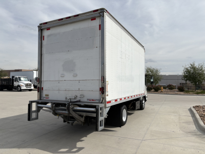 Isuzu NPR-HD box truck rear view showing blank white cargo box with bumper and wheels, no visible labels or text.