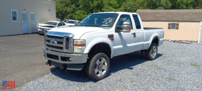 Ford F-350 Super Duty pickup truck with single rear wheel, white, extended cab, in a lot.