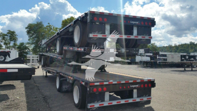 Manac dropdeck trailer shown from rear-left side, flatbed with dual axles and foldable rear ramp, VIN 5MC124810V3240173, stock V3240173.