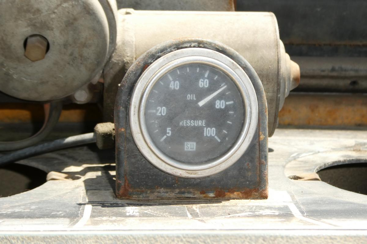 Case 480C loader dashboard gauge showing oil pressure and other indicators.