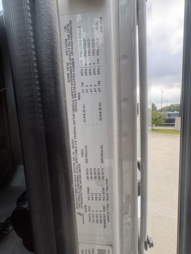 Truck door sticker with vehicle specifications and labels visible in the image.