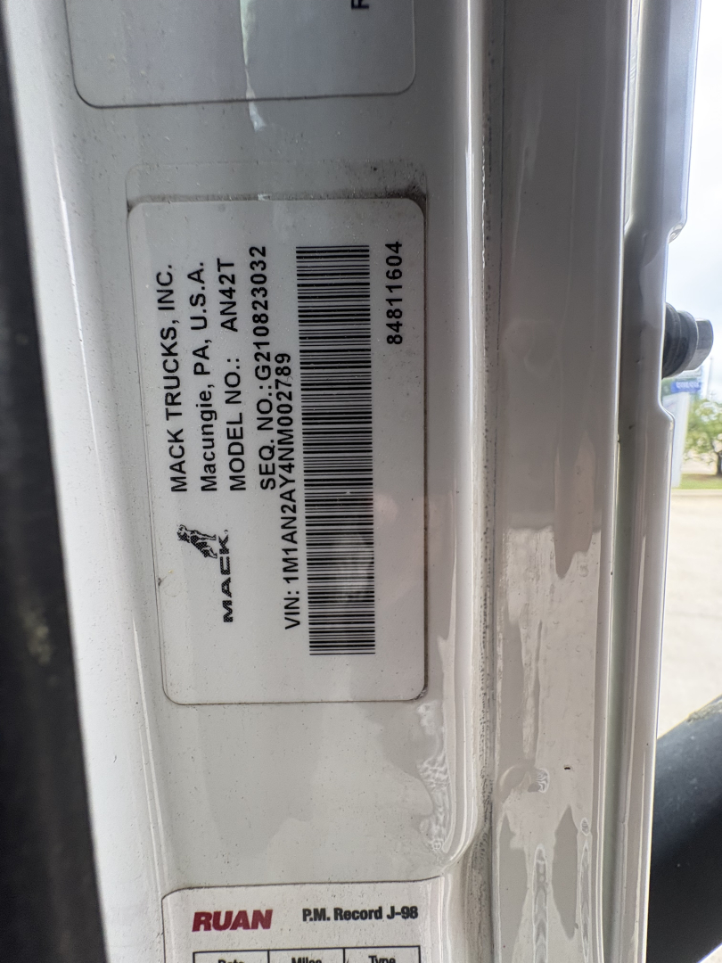 Mack Trucks VIN sticker with barcode and data showing Mack Trucks Inc., product 1M1AN2AY4NM002789, AN42T model, P.O. number 269202, A.S.A. 12-?; small door jamb view.