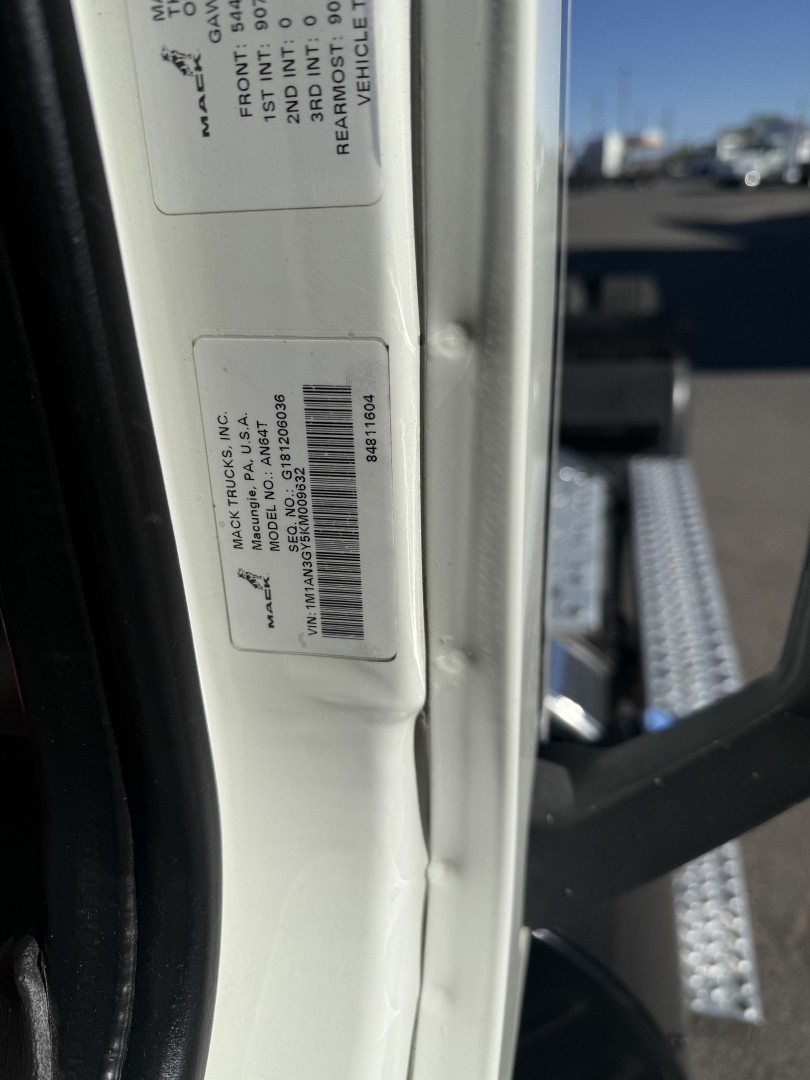 Tag on door frame with VIN and stock number labels for a 2019 Mack ANTHEM Daycab truck. Visible text includes VIN, stock number B3217L, and vehicle category/usage details.
