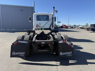 Rear view of a 2019 Mack Anthem daycab truck chassis showing 6x… rear mud flaps with ‘Bruckner’ logo and equipment branding.