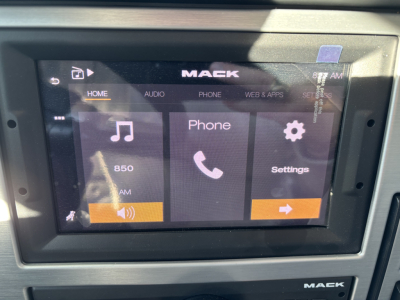 Mack PI64 dash infotainment screen showing Home, Audio, Phone, Settings icons and 850 AM time display.